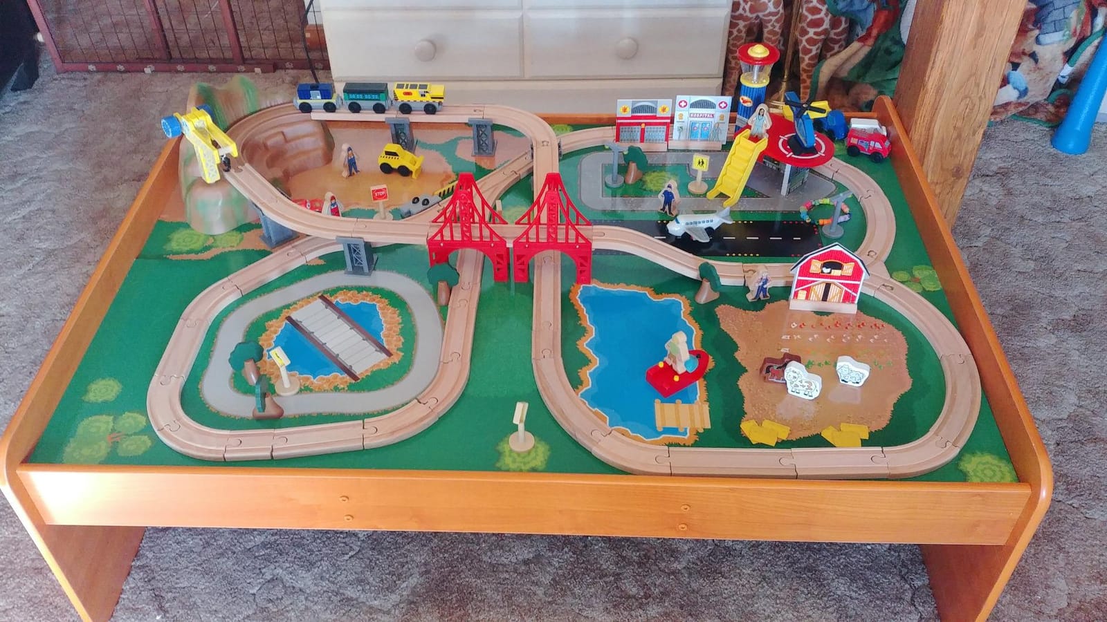 KidKraft Ride Around Town Wooden Train Set and Table with Helicopter, Airplane, Farm, Storage Bins and 100 Pieces customer photo 1