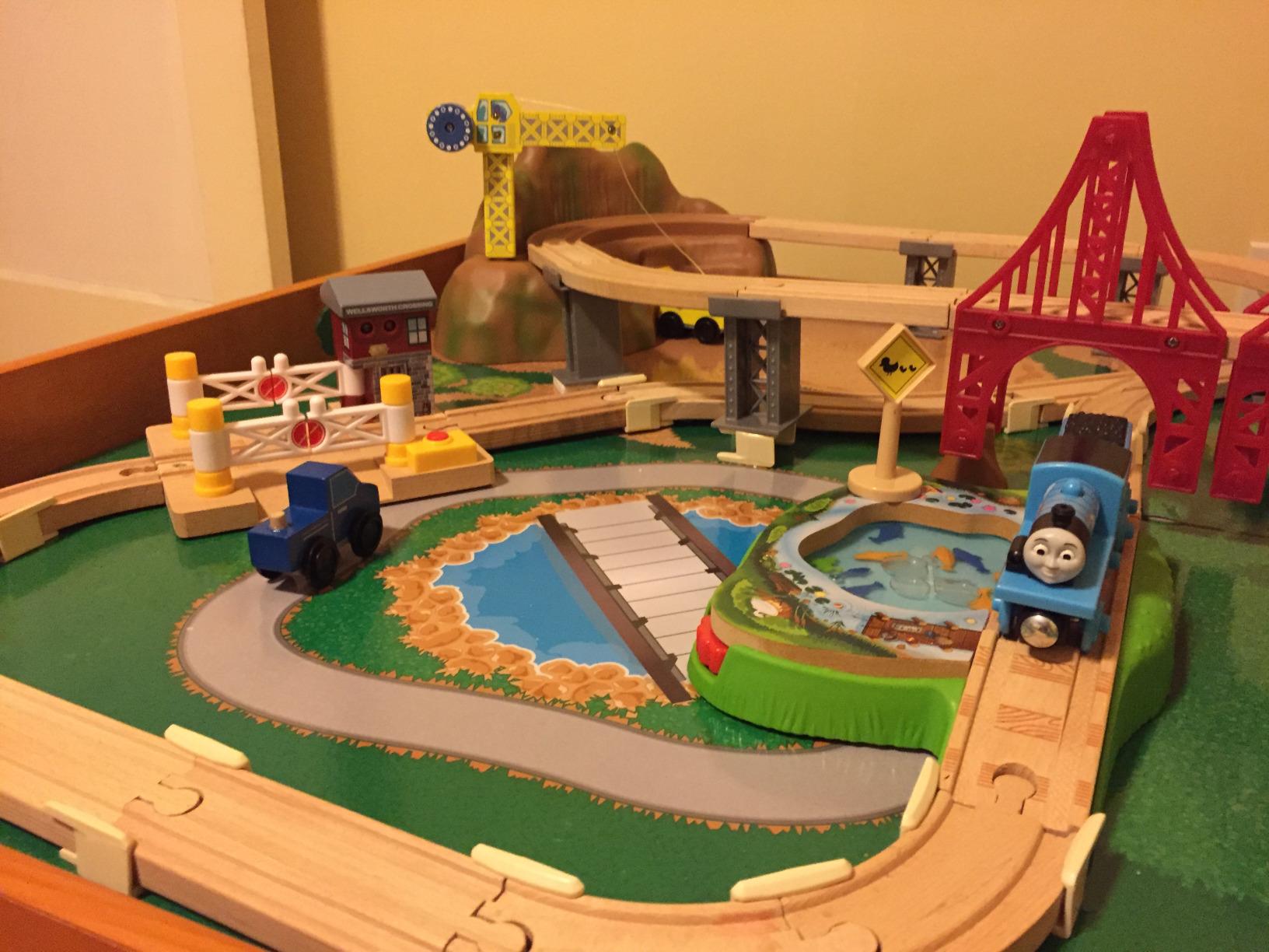 KidKraft Ride Around Town Wooden Train Set and Table with Helicopter, Airplane, Farm, Storage Bins and 100 Pieces customer photo 2