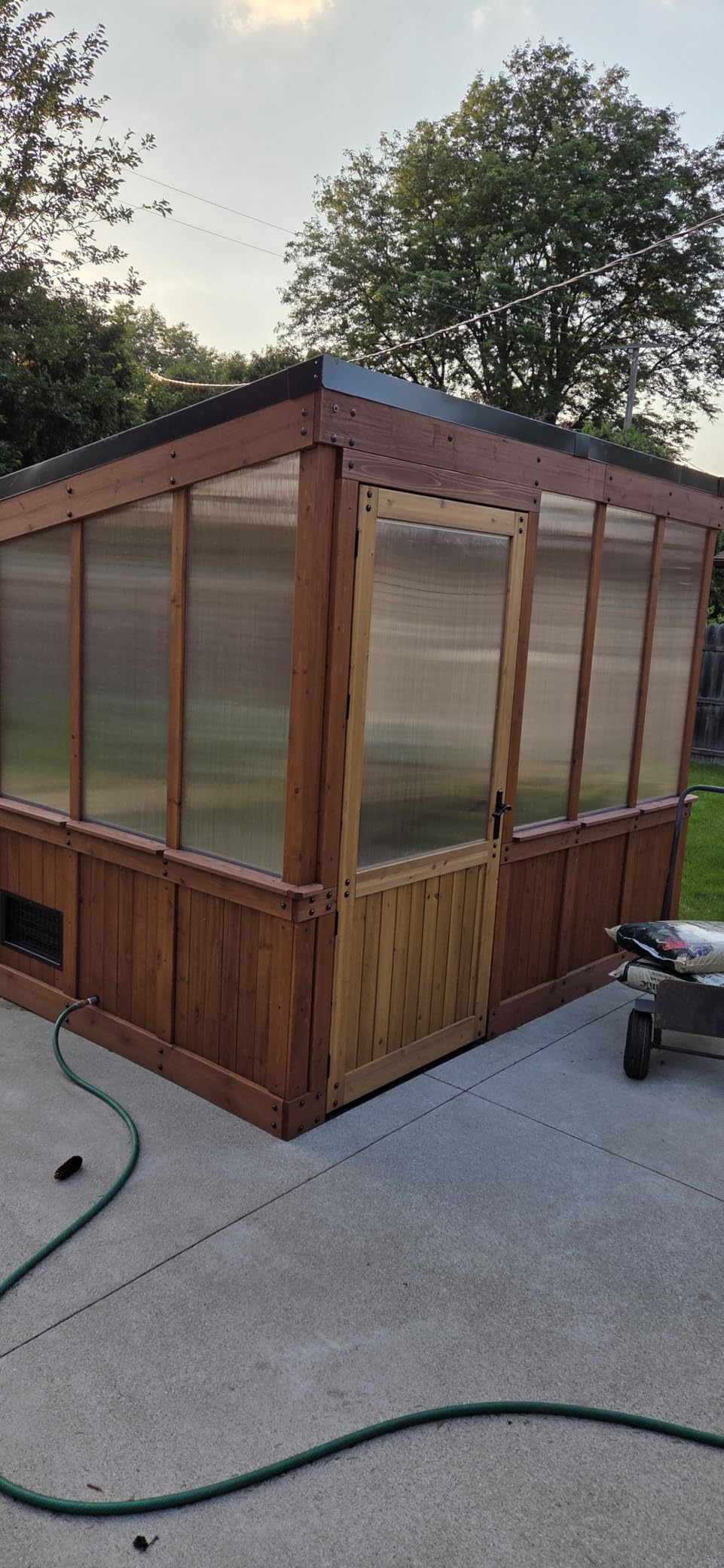 Backyard Discovery Zalie 11' x 7' Cedar Wood and Polycarbonate Walk-in Greenhouse Kit with Exhaust Fan, Windows, Hose Hook-Ups, PowerPort, Staging Shelves for Year-Round Outdoor Gardening customer photo 1