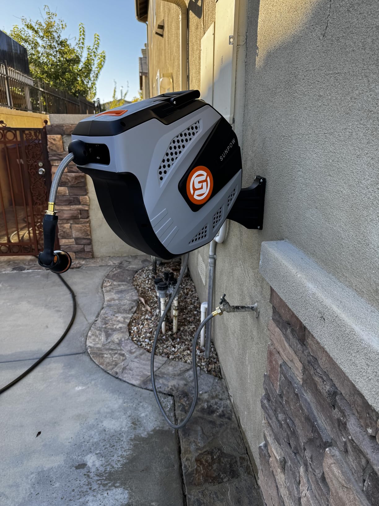 SUNPOW Retractable Garden Hose Reel - 1/2 inch x 50ft Heavy Duty Wall Mounted Hose Reel with 3/4 inch Brass Fitting & 10 Sprayer Nozzle - Any Length Lock, Auto Rewind System, 180°Swivel Bracket- Grey customer photo 2
